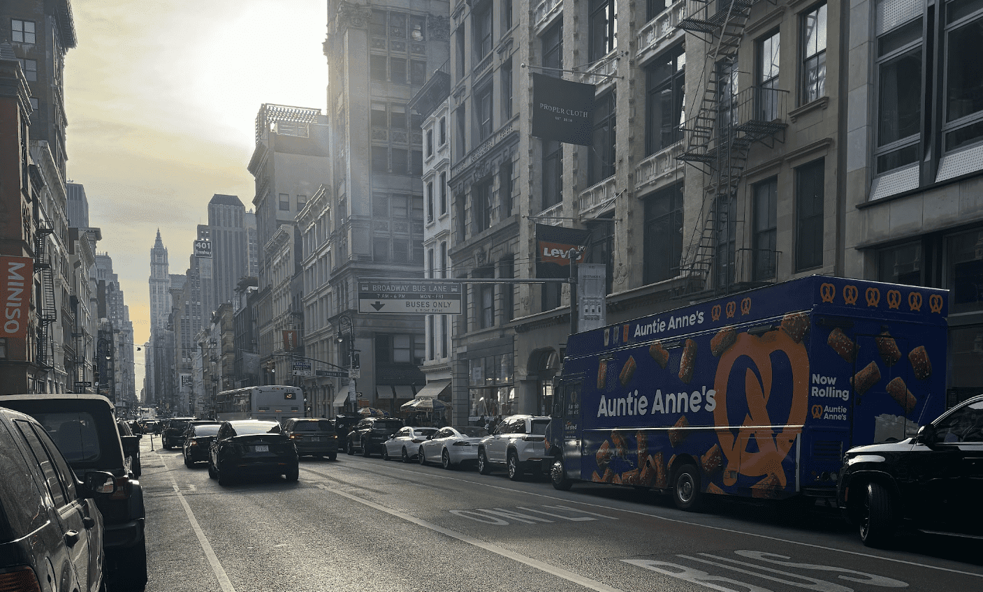 A professional food truck serving a large corporate crowd at an outdoor event in NYC.