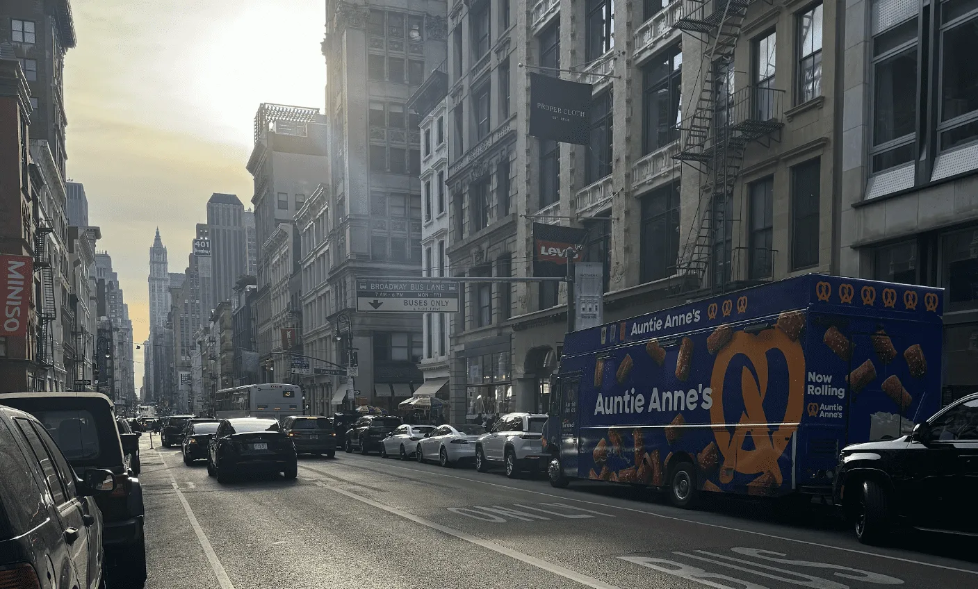 A professional food truck serving a large corporate crowd at an outdoor event in NYC.
