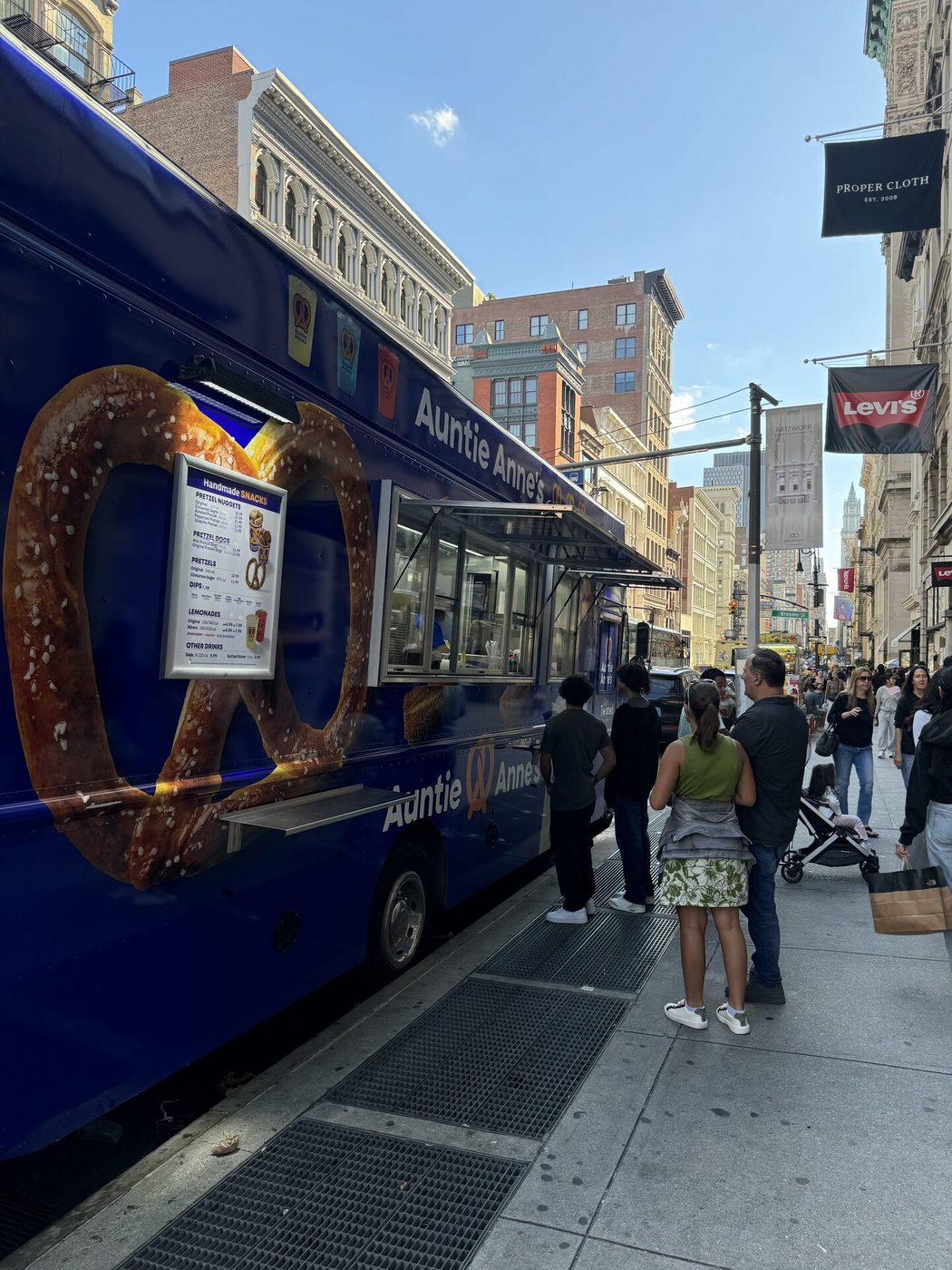 Auntie Anne's food truck serving a line of guests on a Manhattan street