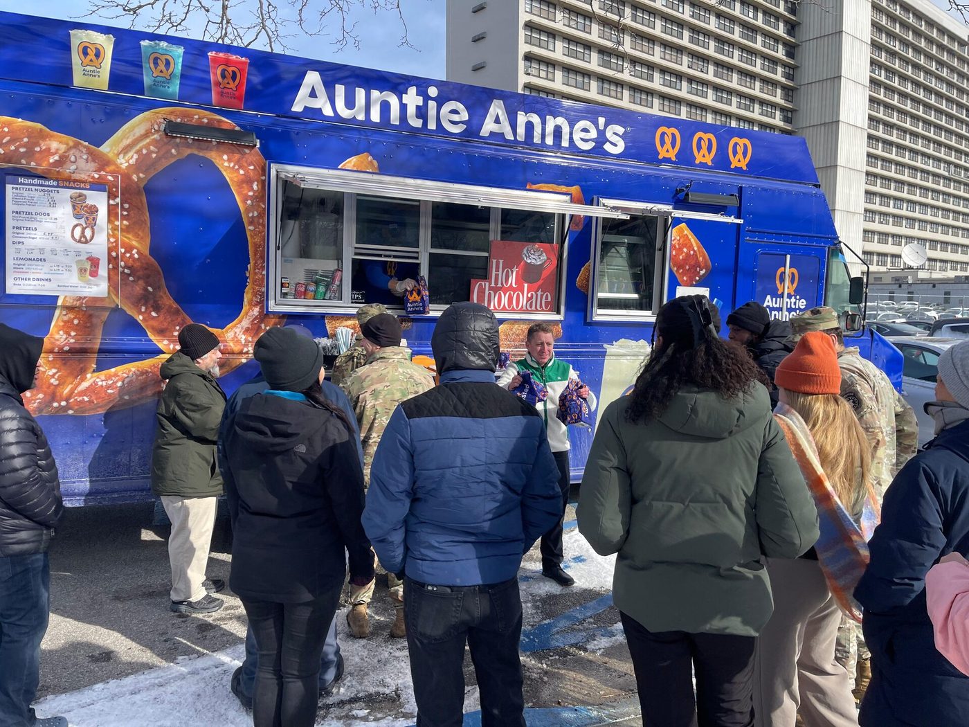 Snack City NYC staff serving a winter crowd at the truck window