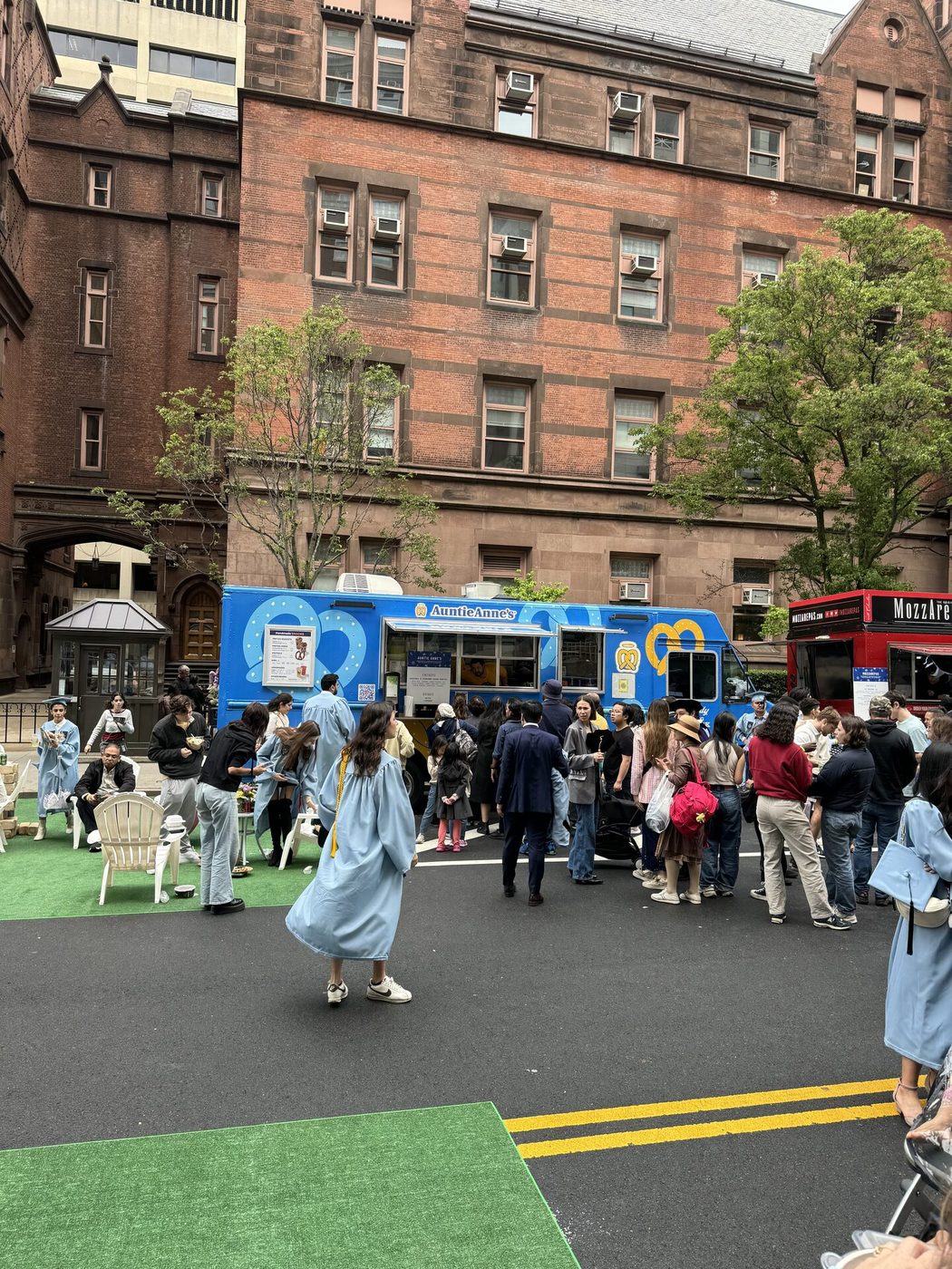 Auntie Anne's food truck surrounded by students on an NYC campus